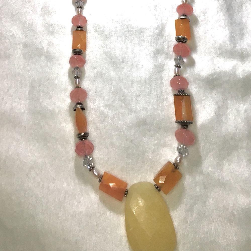 Beaded necklace with quartz stone drop.